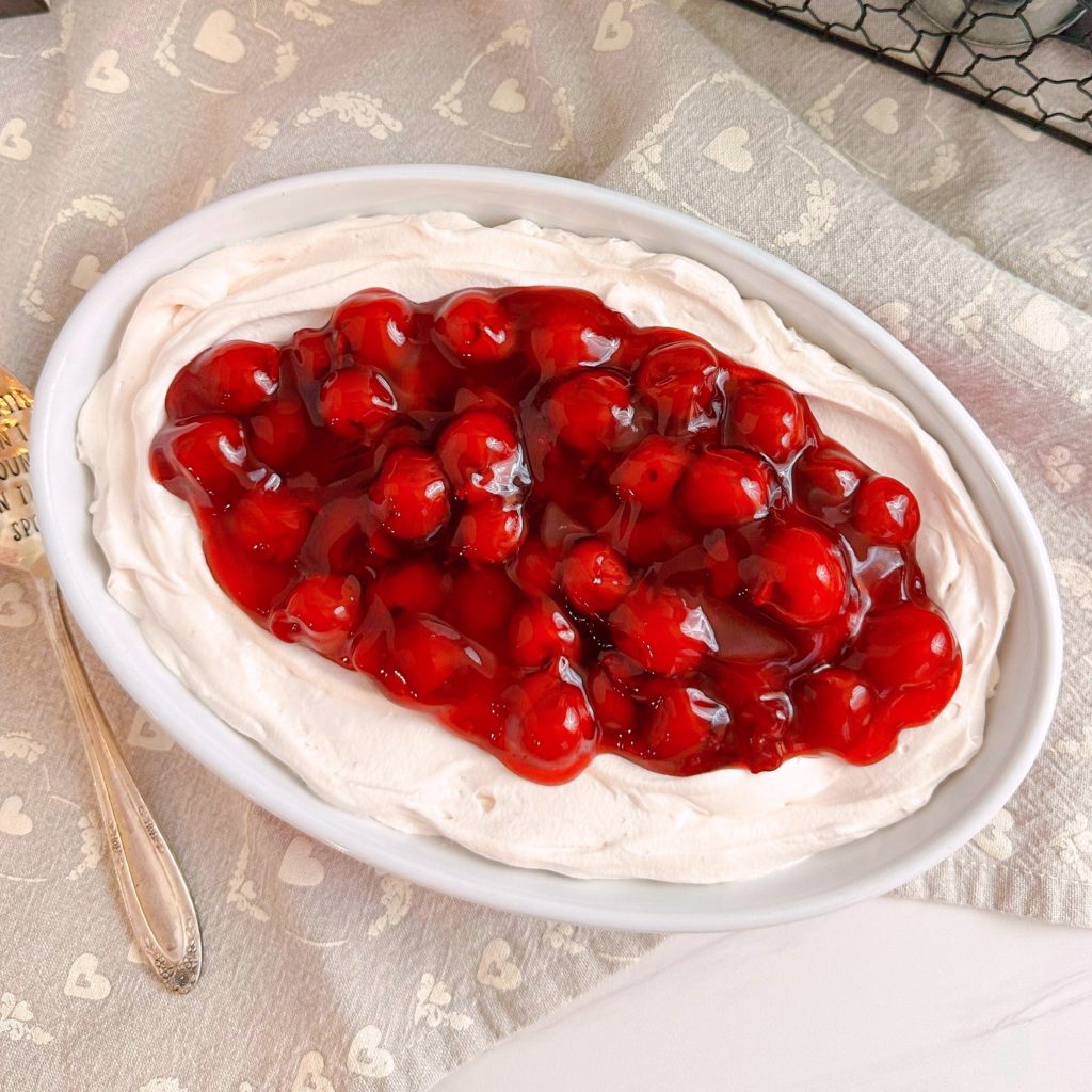 Bowl filled with Cherries in a Cloud Dip over head shot.