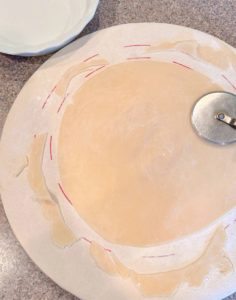 Bottom pie crust rolled into a circle and trimmed.