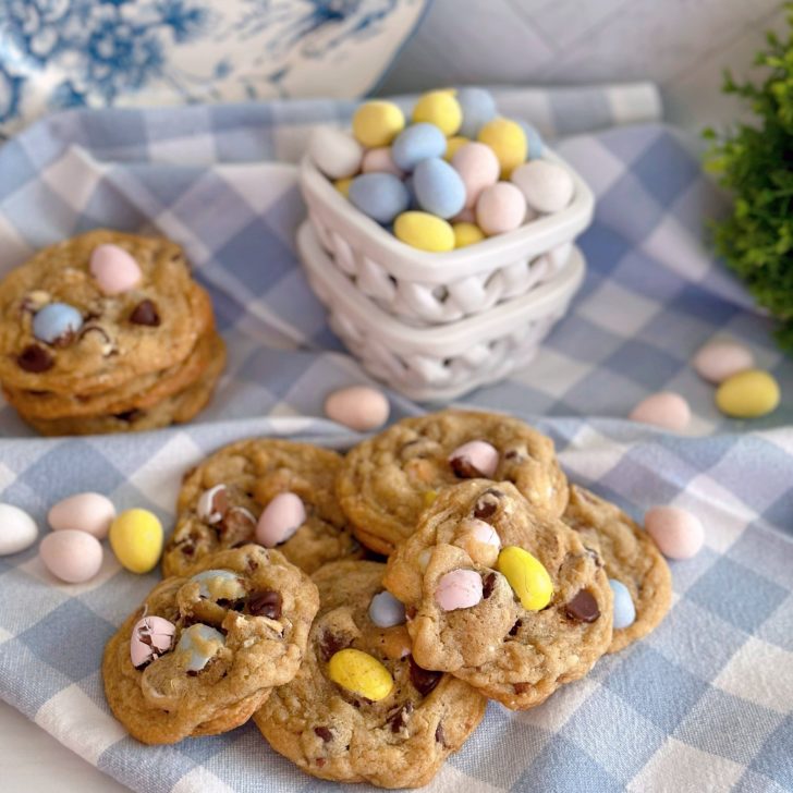 Cookies in a pile with mini cadbury eggs all around.