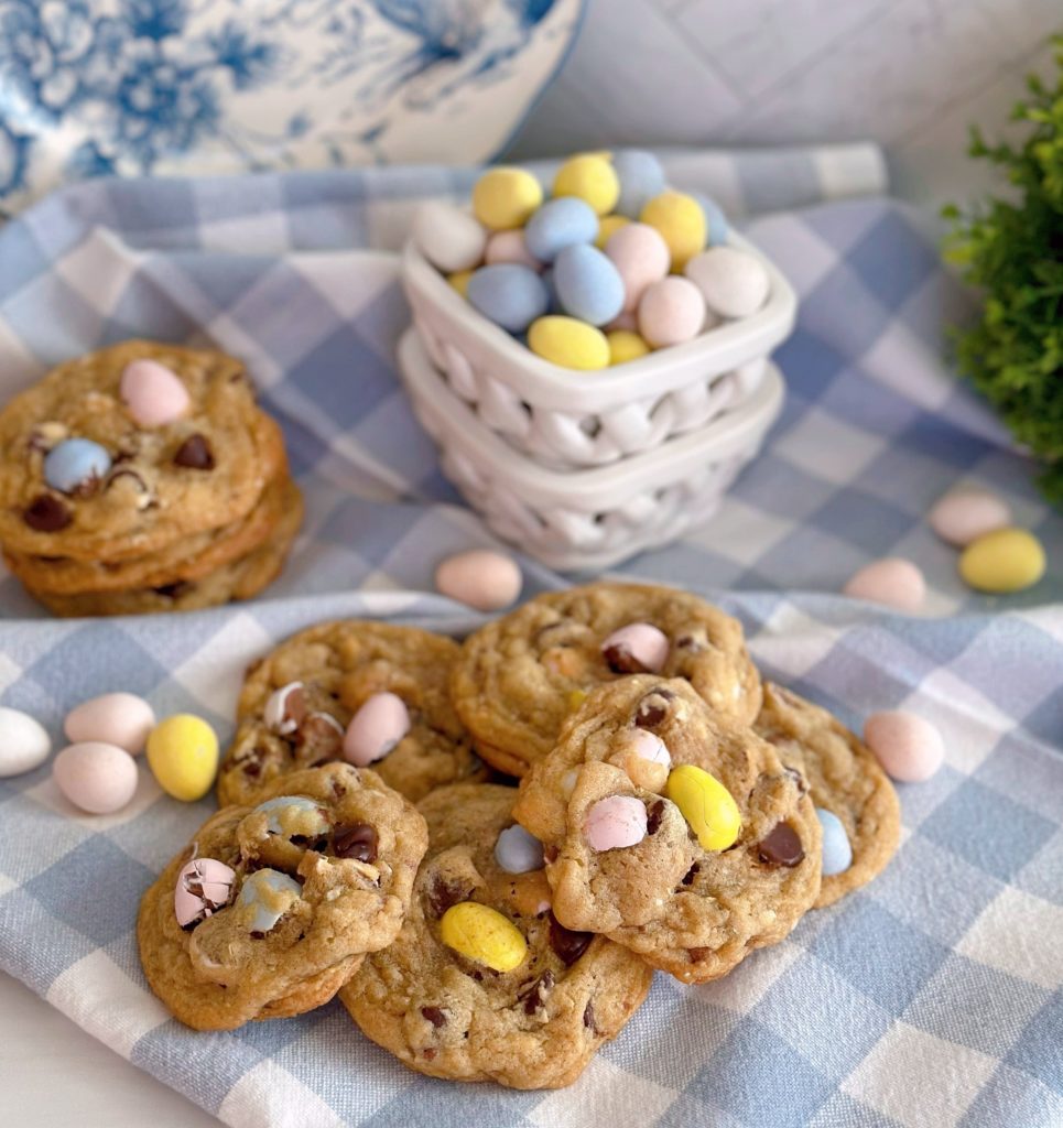 Cookies in a pile with mini cadbury eggs all around.