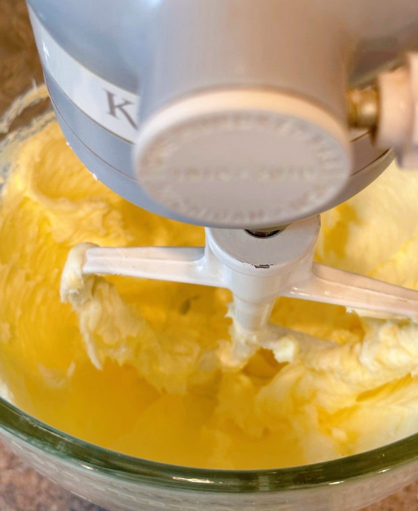 Creaming butter in bowl of the mixer.