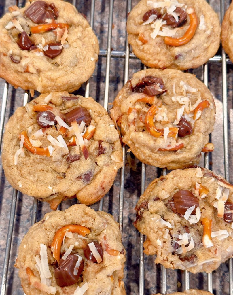 Trash can chocolate chip cookies on a cooling rack to cool.