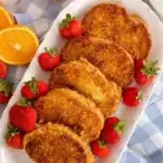 Platter full of Crispy Cinnamon French Toast with fresh strawberries.