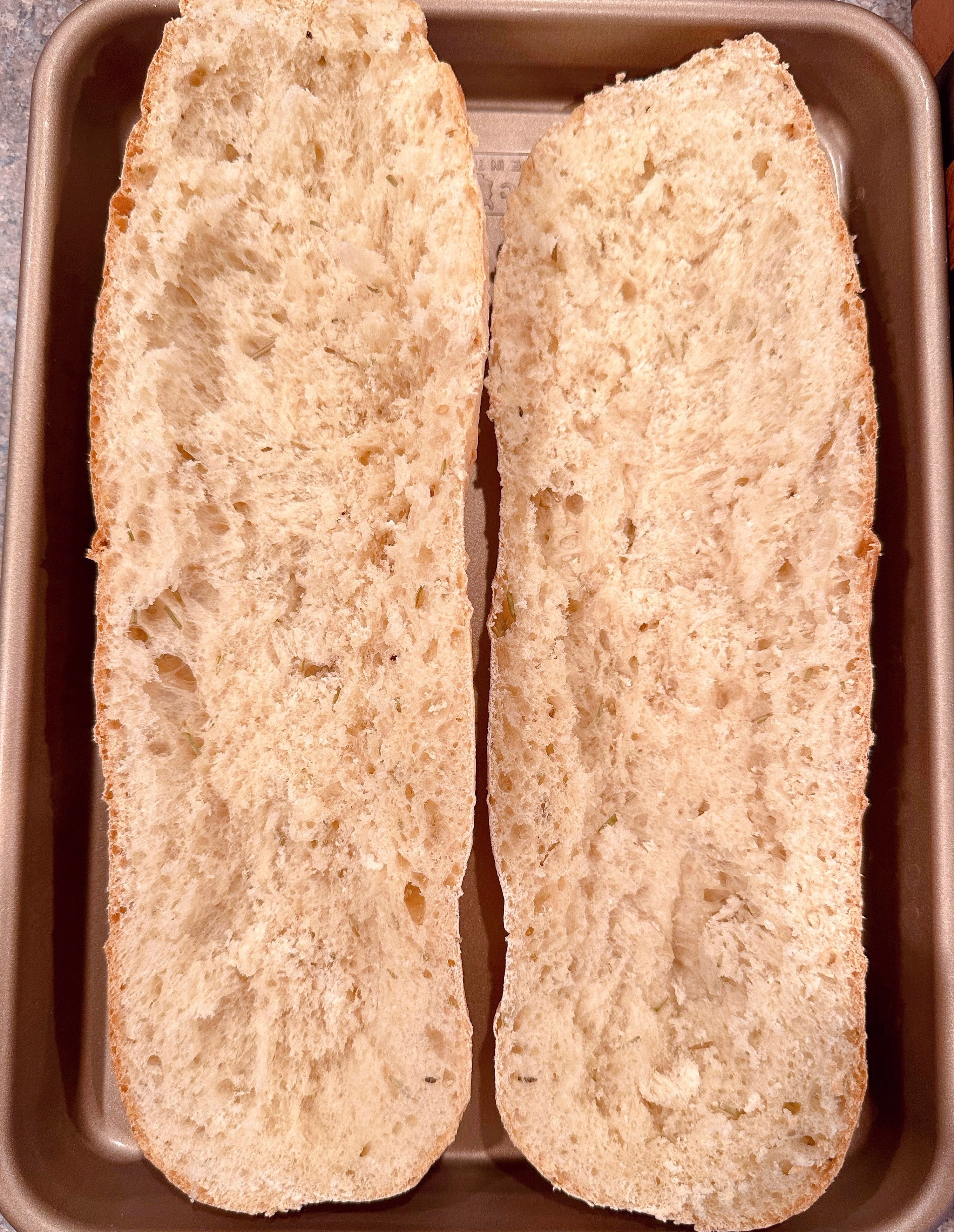 Italian Loaf of bread with center of bread removed to create a trough.