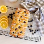 Lemon Blueberry Bread with Lemon Glaze on cooling rack.