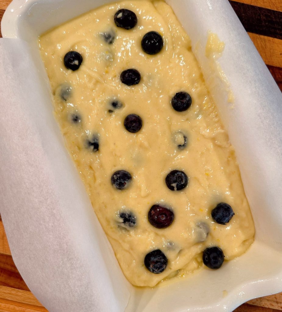 Lemon Blueberry Bread batter in prepared loaf pan.