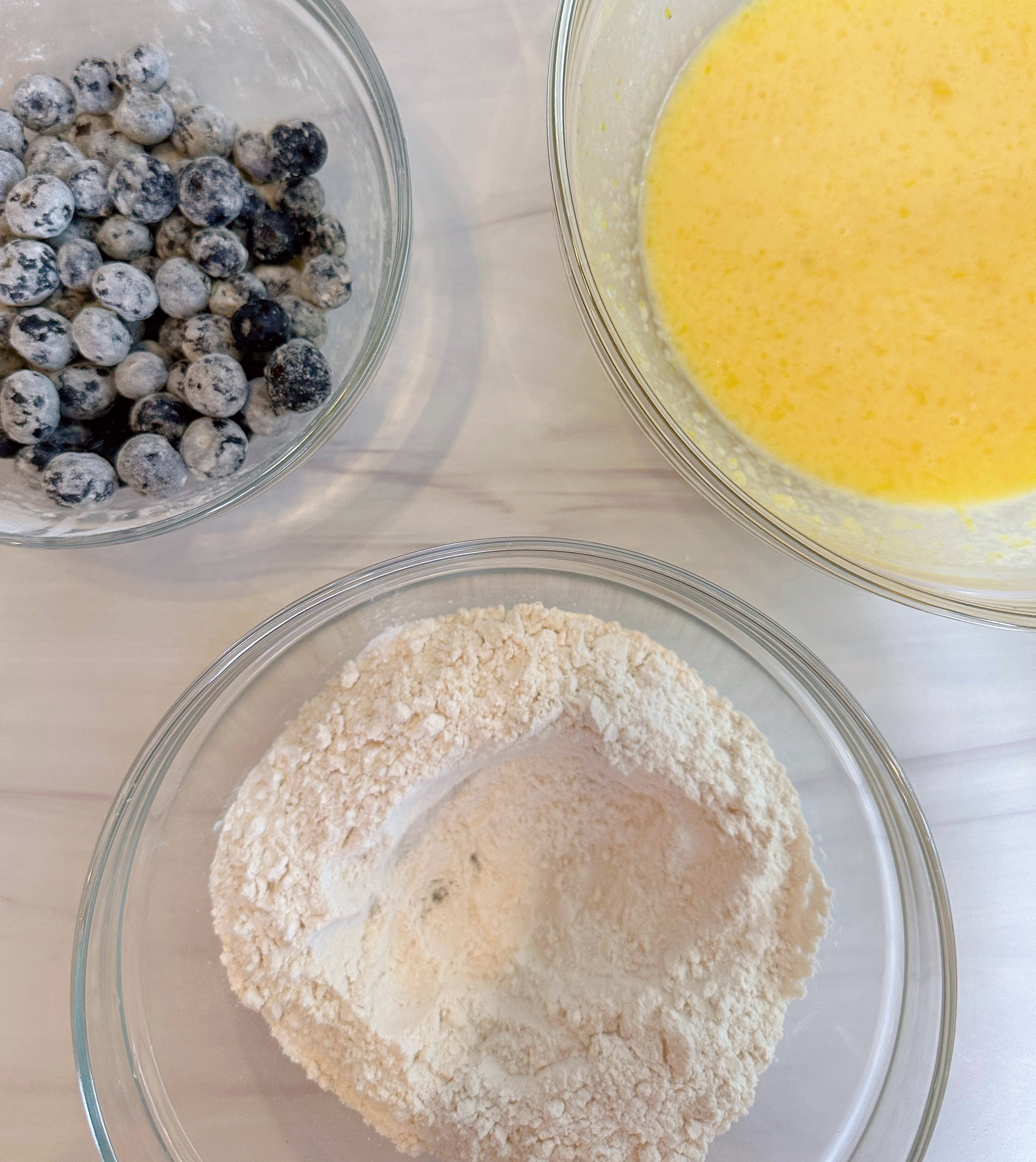 Creating a well in the center of the flour.