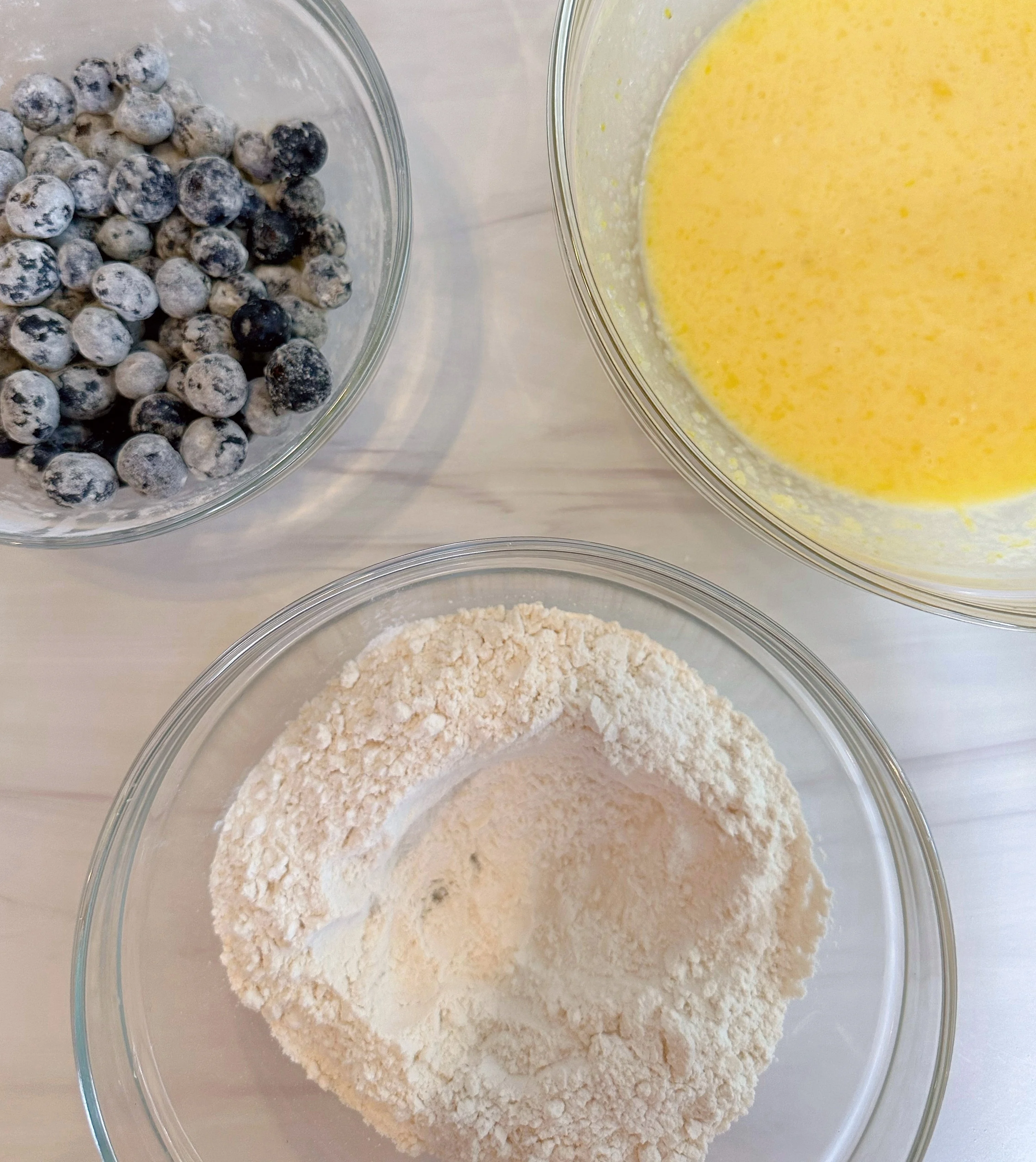 Creating a well in the center of the flour.