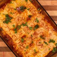 Overhead shot of entire casserole fresh out of the oven sprinkled with cilantro.