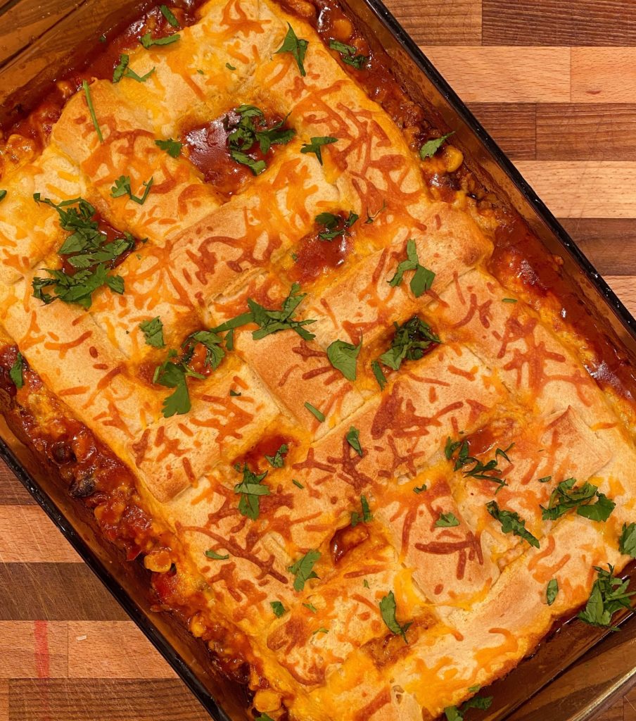 Overhead shot of entire casserole fresh out of the oven sprinkled with cilantro.