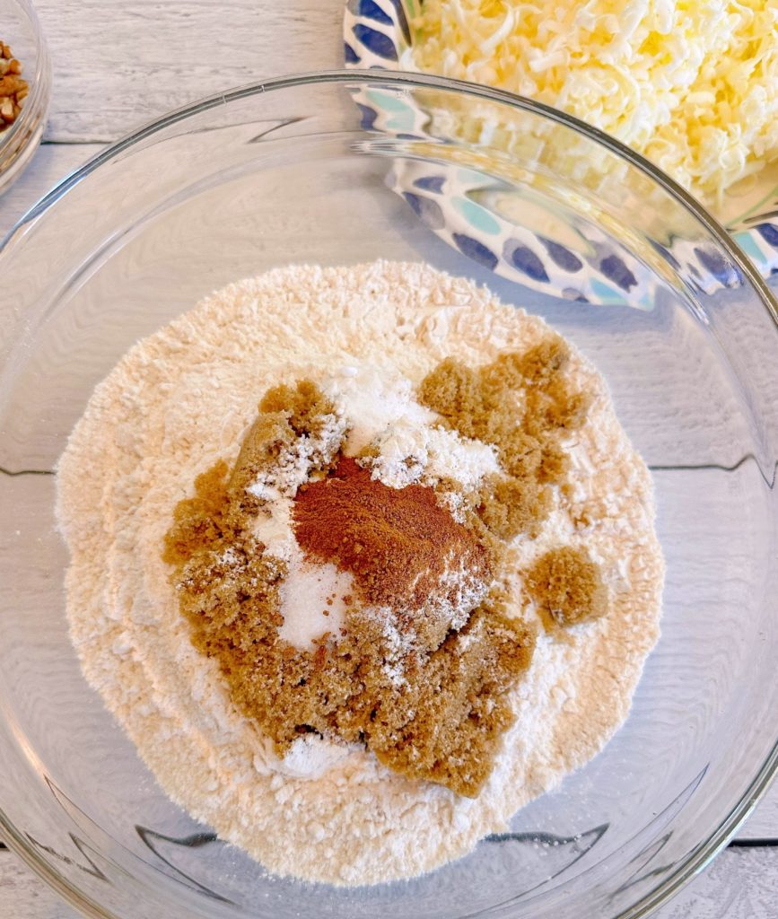 Adding brown sugar, spices, and baking soda to flour mixture.