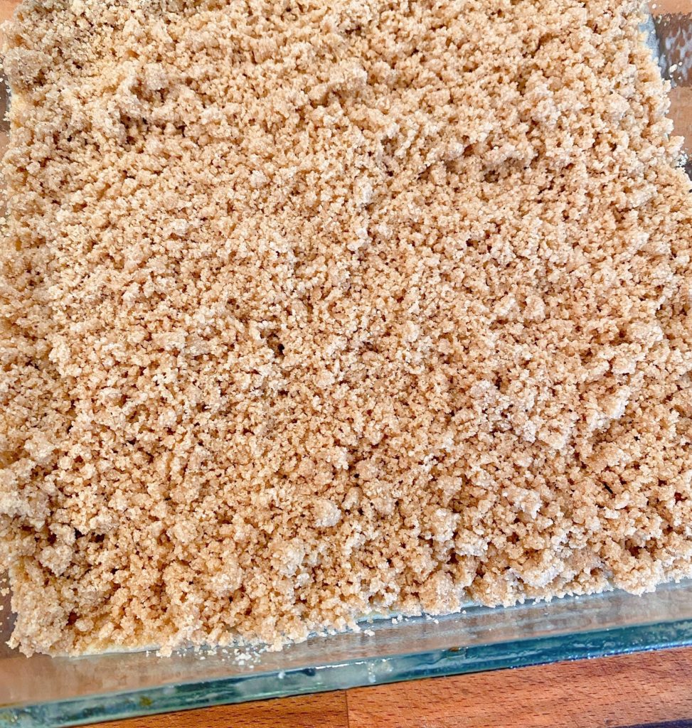 Streusel topping over the top of the coffee cake batter.