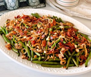 Balsamic Green Beans with Bacon on a white platter.