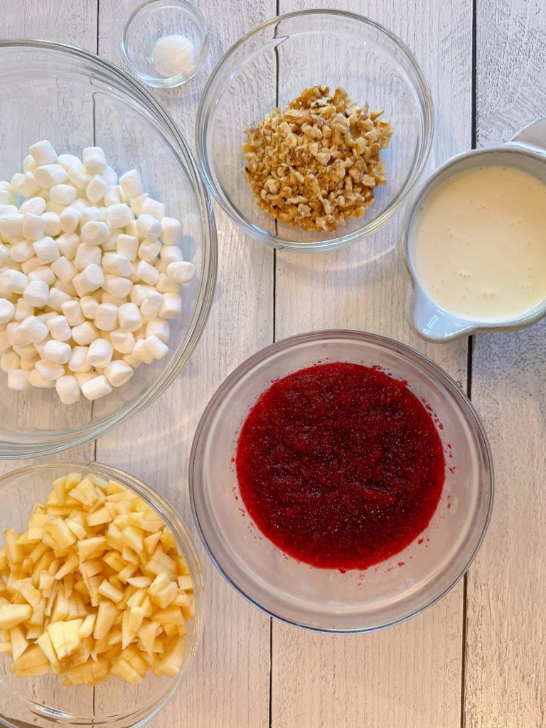 Ingredients for Cranberry Apple Fluff on a white board.