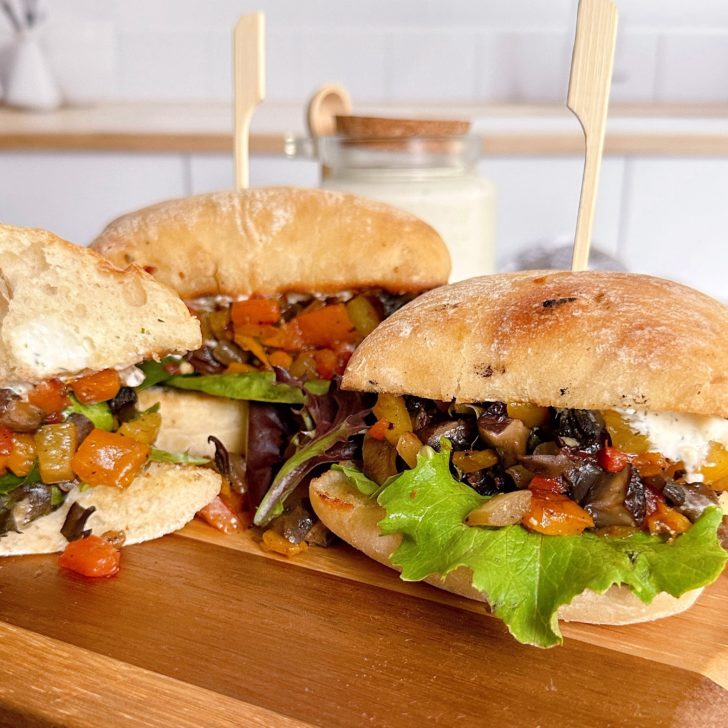 Greek Portobello Sandwiches on a cutting board.