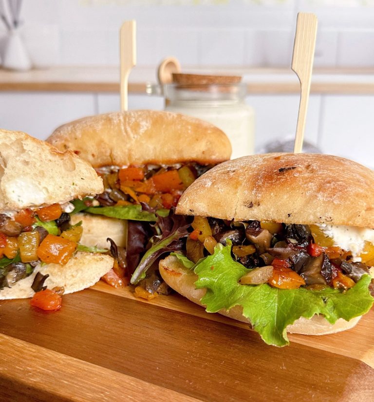 Greek Portobello Sandwiches on a cutting board.