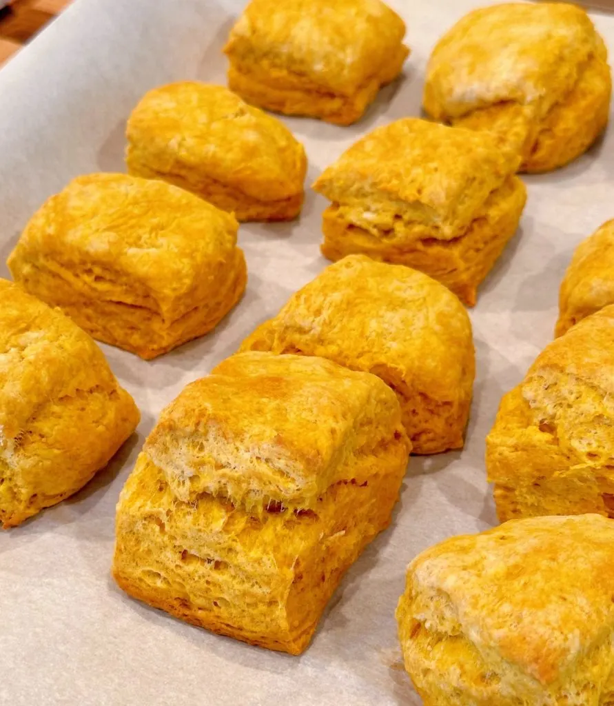 Baked biscuits on baking sheet. 