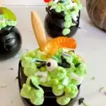 Close-up of each cauldron with candy worms and sprinkles.