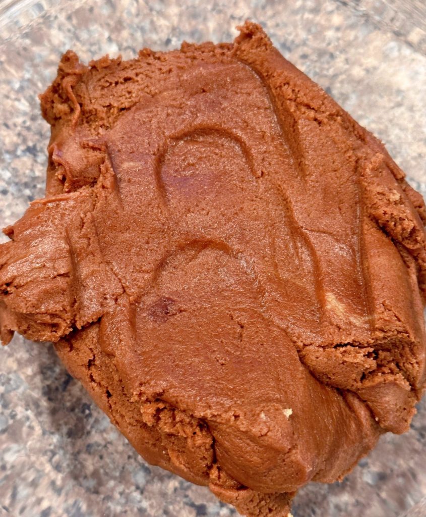 Chocolate cookie dough in mixing bowl.