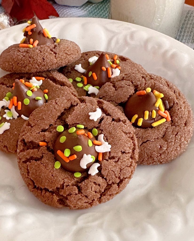 Chocolate Peanut Butter Blossom Cookies on a white serving plate.