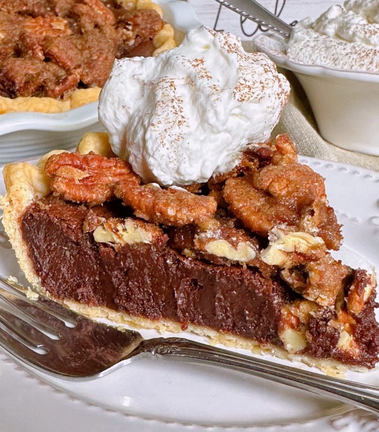 Close-up photo of Chocolate Pecan Chess Pie slice with whipped cream.