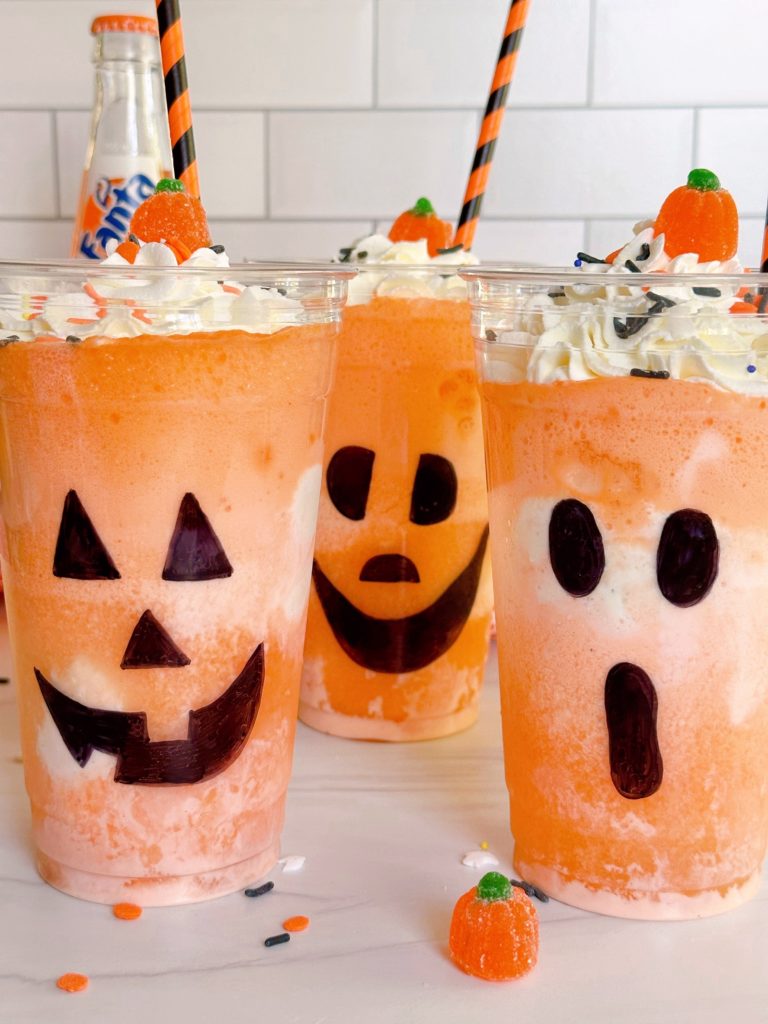 Fanta Jack O'lantern Halloween Floats with festive straws and sprinkles.