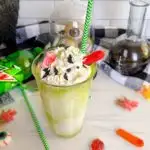 Mountain Dew Ice Cream Float with gummy decorations.