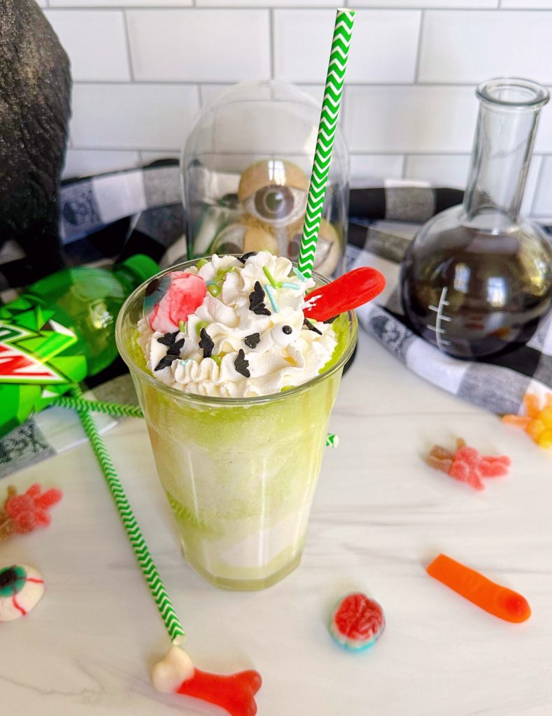 Mountain Dew Ice Cream Float with gummy decorations.