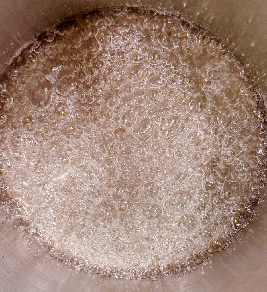 First stage of boil bubble in sauce pan. 