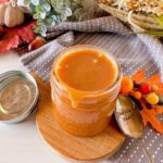 Overhead shot of caramel sauce in a mason jar.