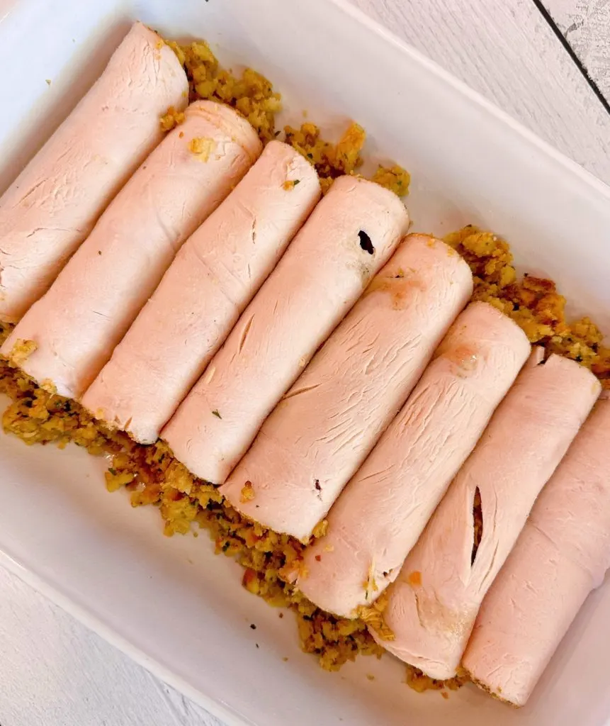 Turkey Roll-ups in a baking dish waiting for the gravy.