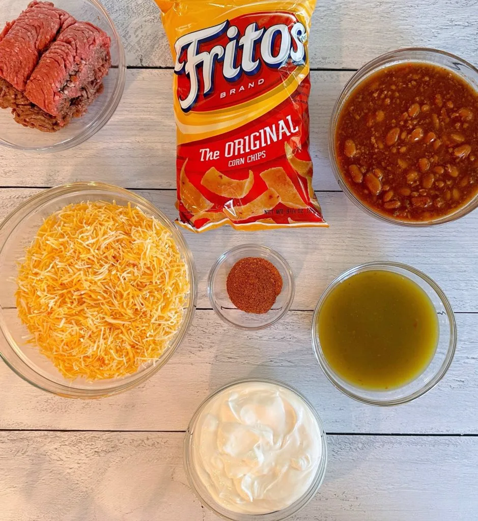 Frito Pie Ingredients on a white board.