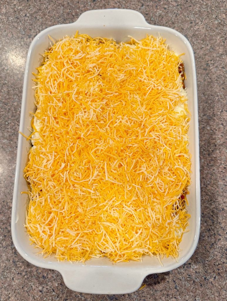 Casserole topped with grated Mexican cheese.