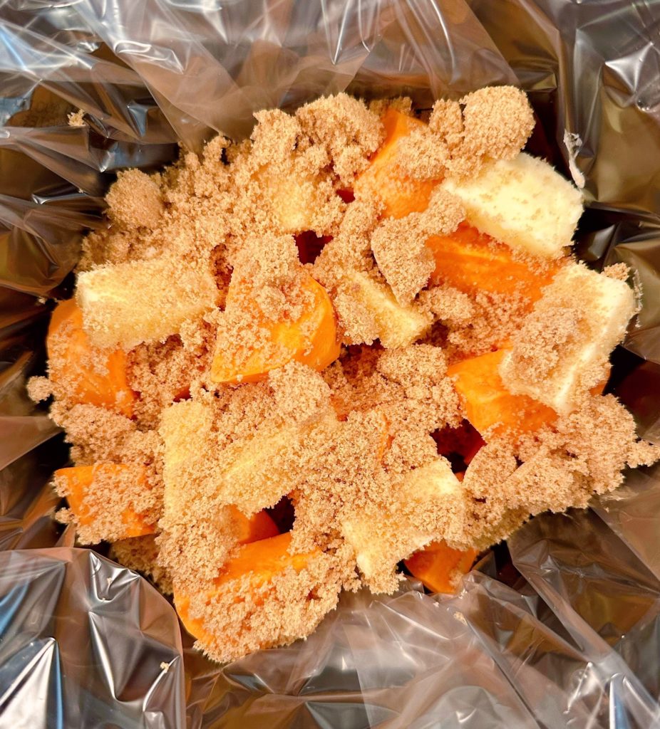 Brown Sugar placed on top of butter and yams.