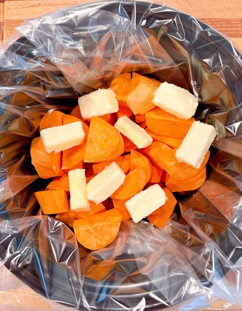 Butter placed on top of sweet potatoes.