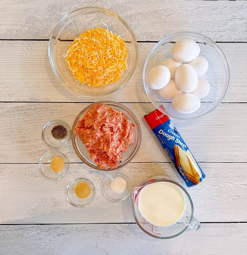 Ingredients for Crescent Breakfast Casserole on a white table.