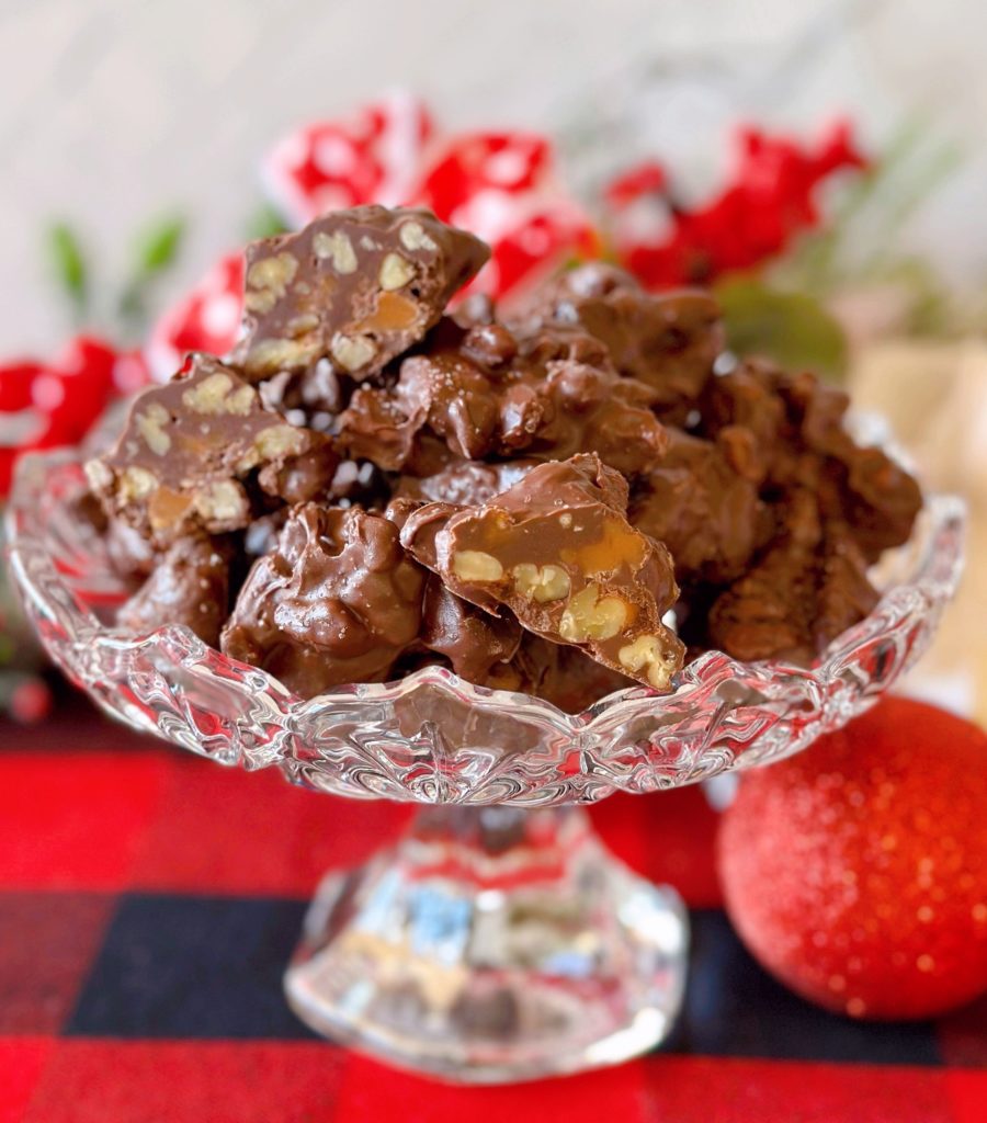 Slow Cooker Chocolate Pecan Turtles in a candy dish.