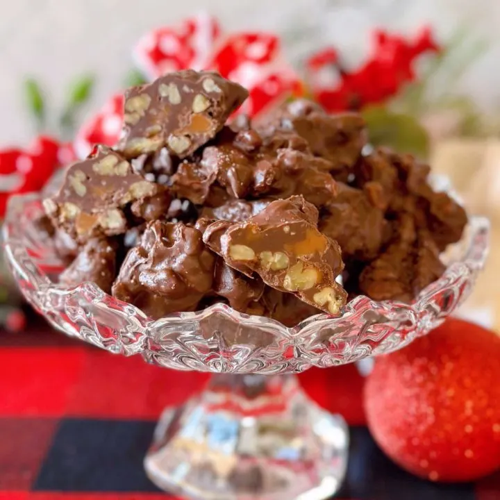 Slow Cooker Chocolate Pecan Turtles in a candy dish.