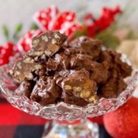 Crockpot Chocolate Turtles in a beautiful candy dish.