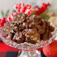 Crockpot Chocolate Turtles in a beautiful candy dish.