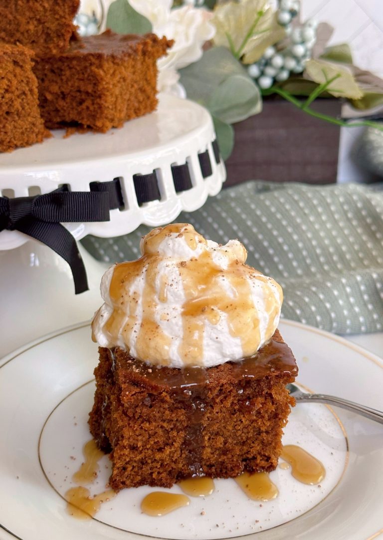 Gingerbread Cake with Caramel sauce on a dessert plate.