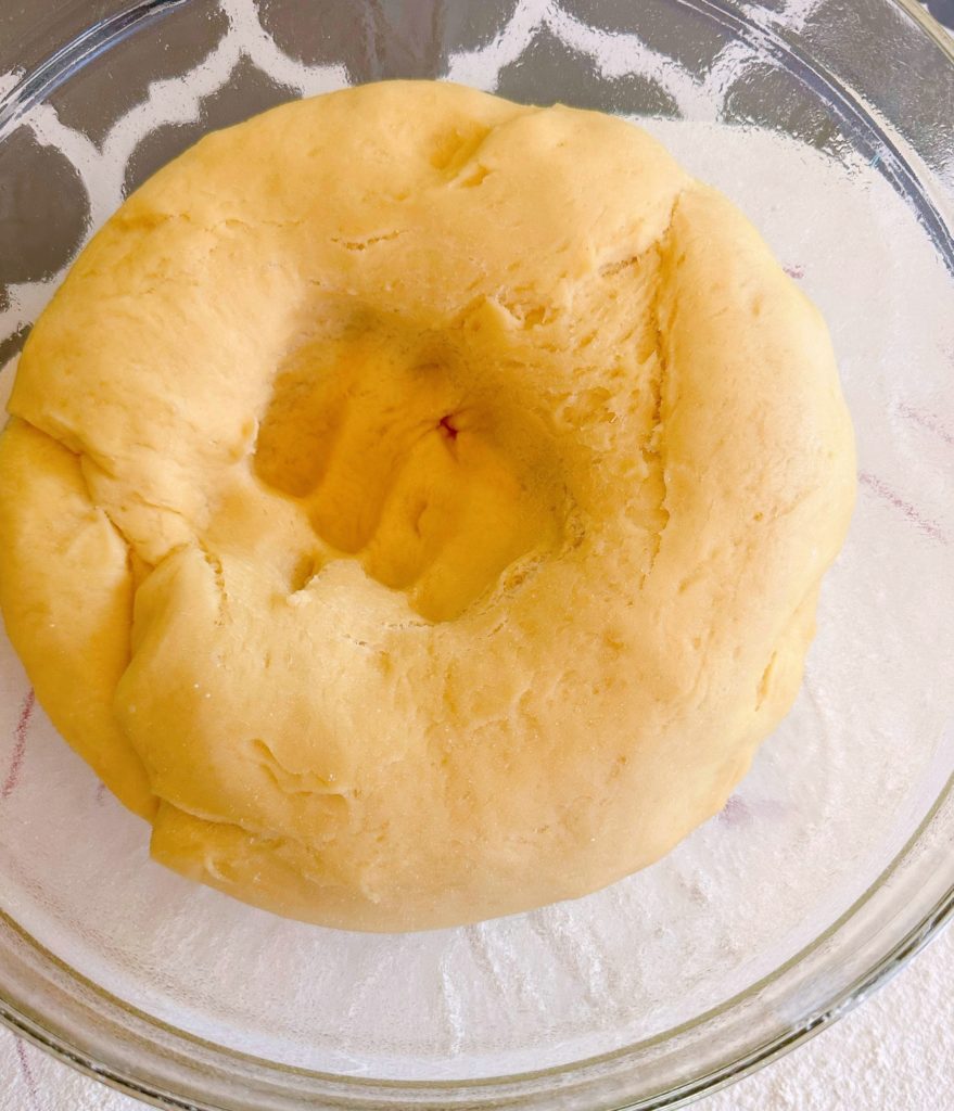 Sweet dough for tea ring, punched down in a large bowl.
