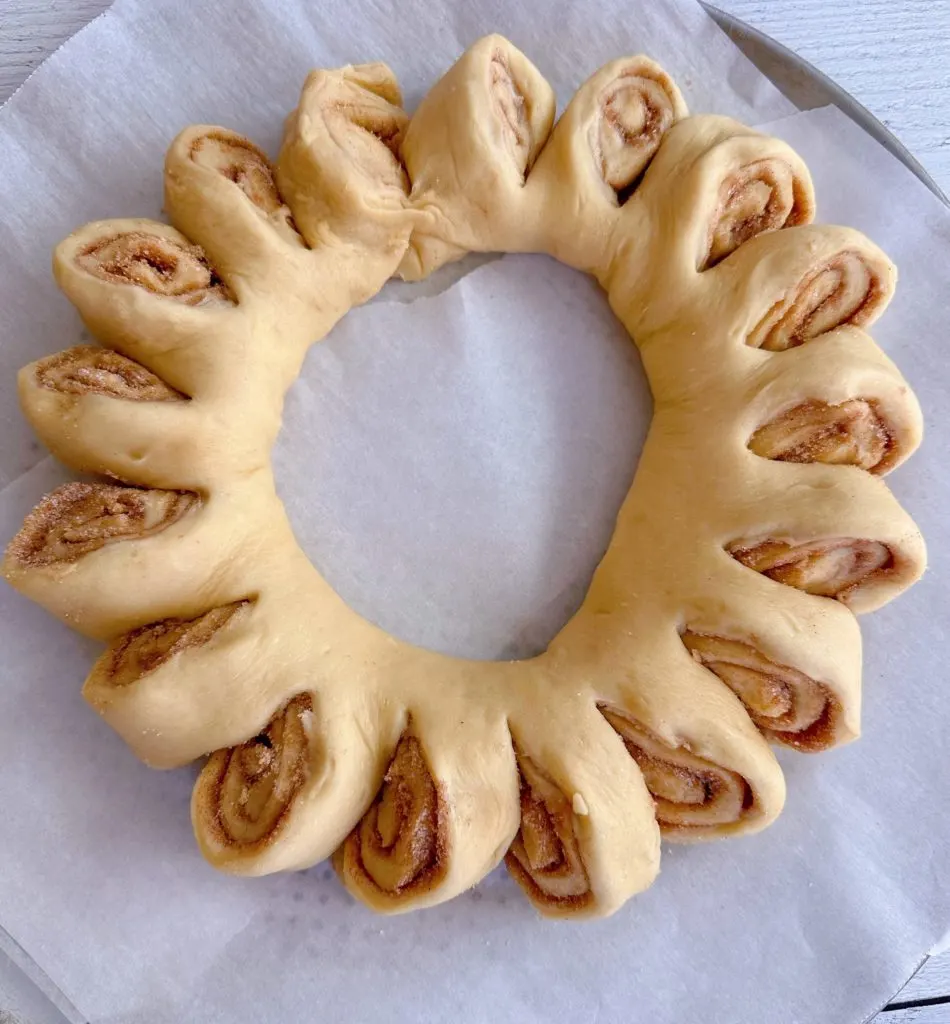 Shaped Tea ring on parchment paper.