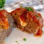 Baked Meatloaves with extra sauce and fresh basil.