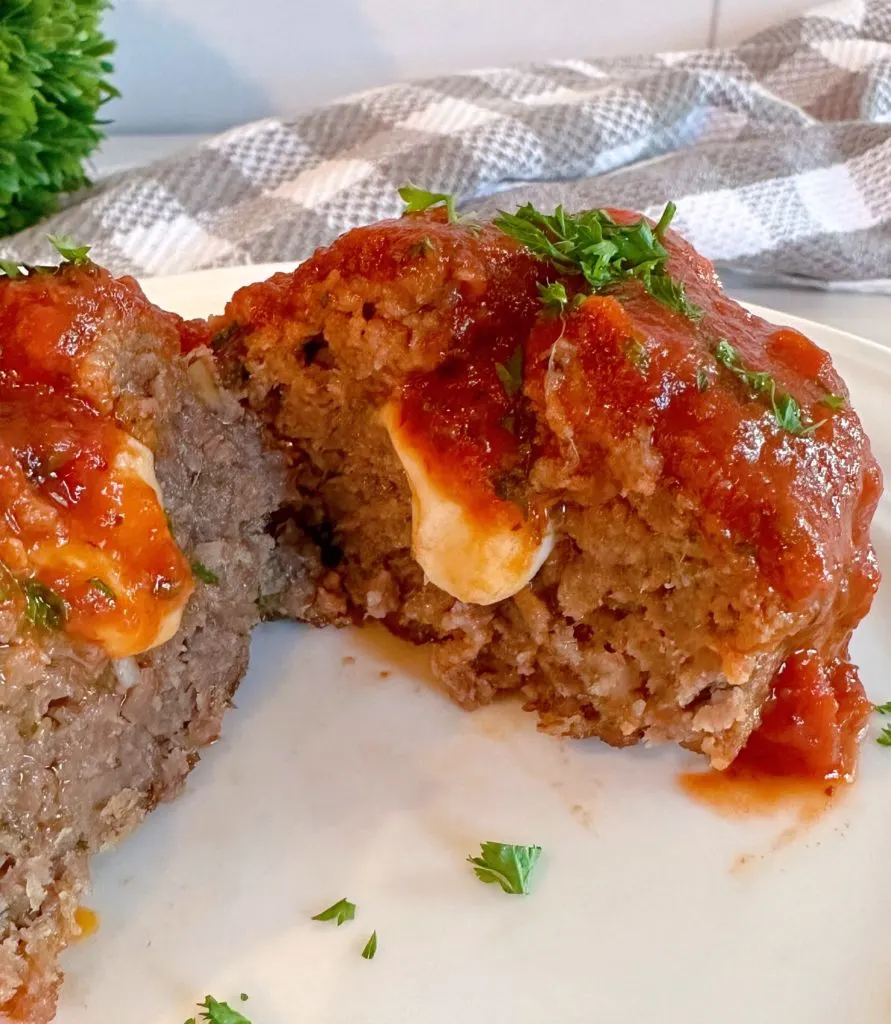 Baked Meatloaves with extra sauce and fresh basil.