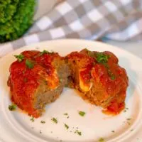 Individual Stuffed Italian Meatloaf cut in half with cheese oozing out!