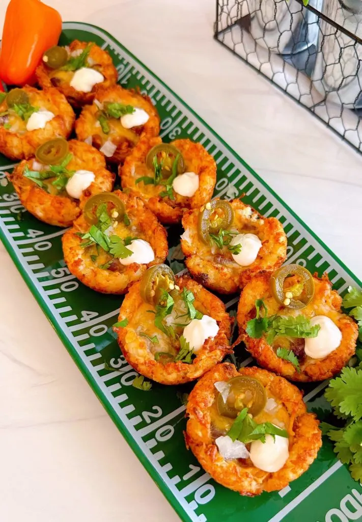 Platter filled with tater chili cup bites.