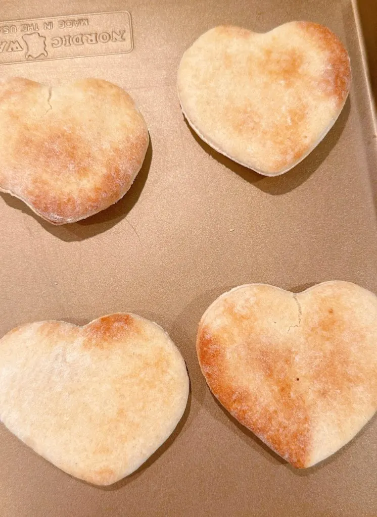 Pre-baked heart shape pizza crust.