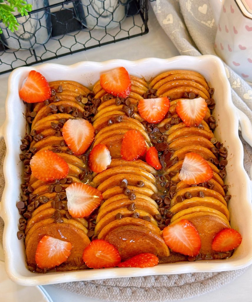 Overhead shot of the Pancake French Toast Casserole with mini-chocolate chips and fresh strawberries.