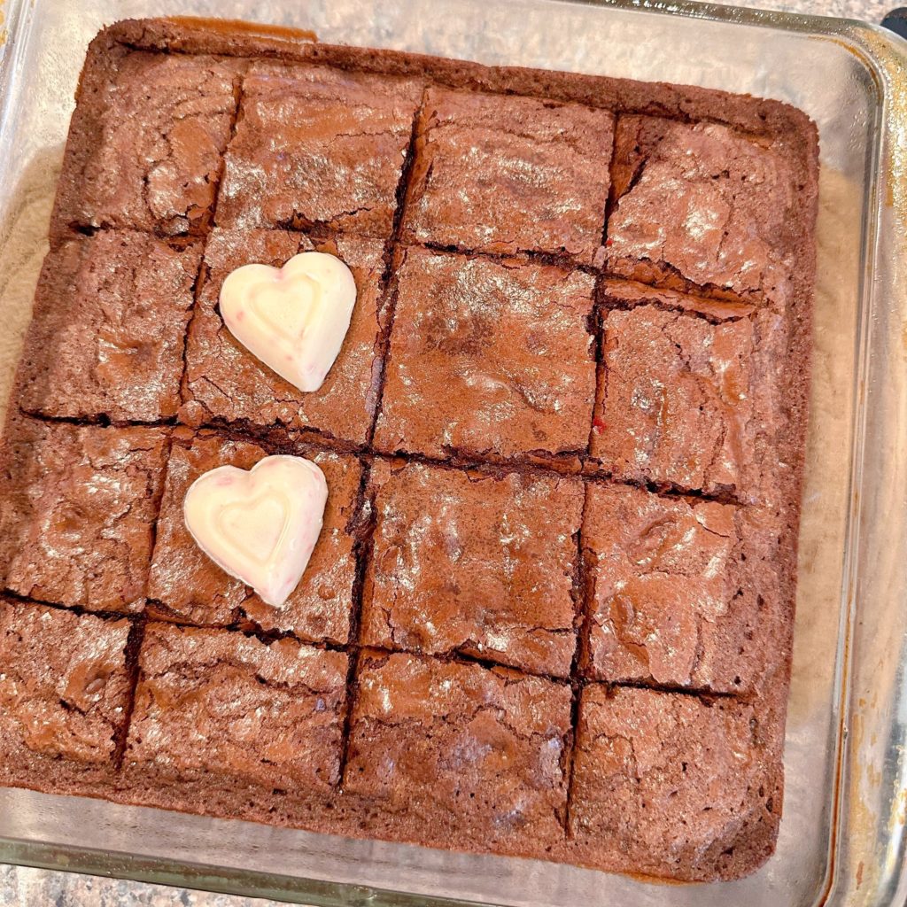 Pan of brownies scored in the baking pan.